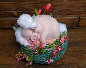 This is a photo of a Spring basket with a pig in it.